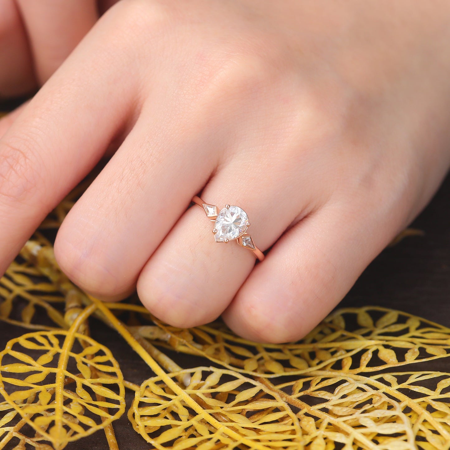 Pear shape moissanite rose gold engagement Ring.