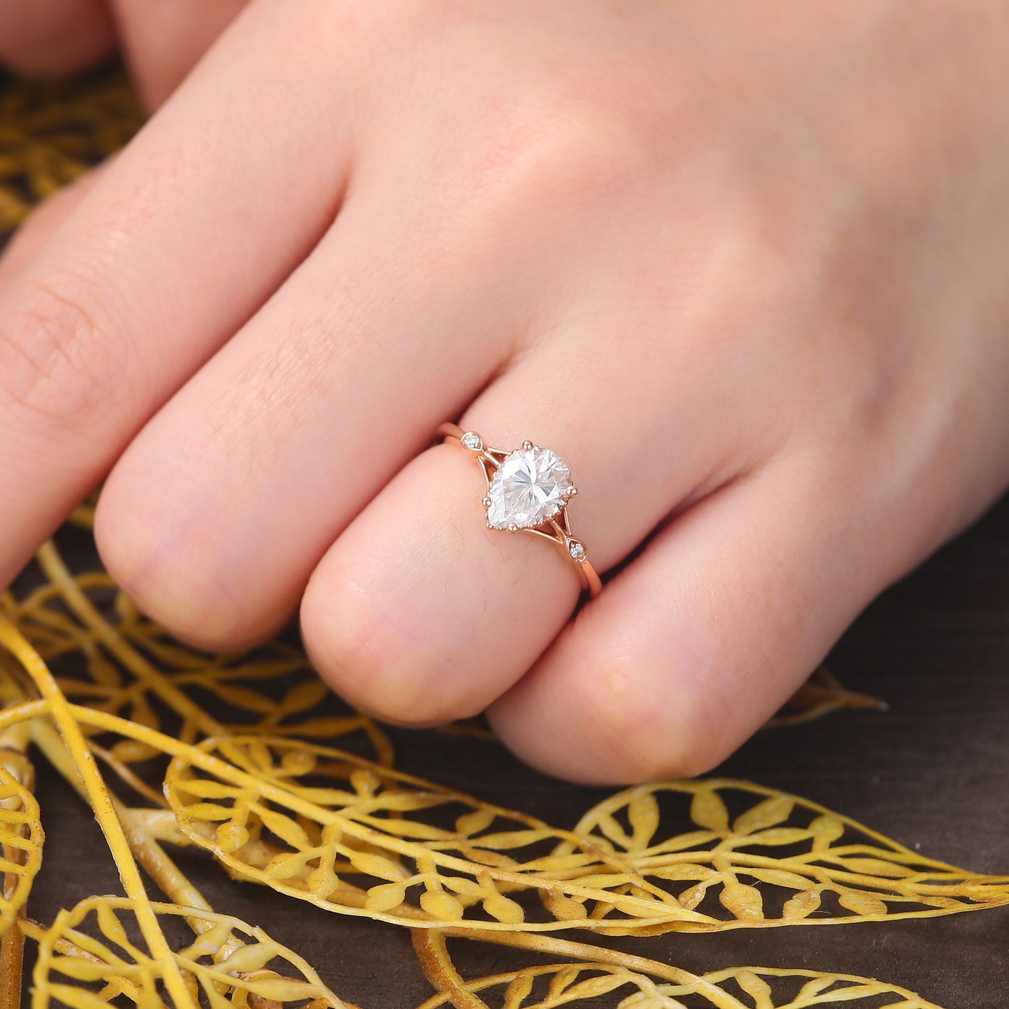 Pear shape moissanite rose gold engagement Ring.
