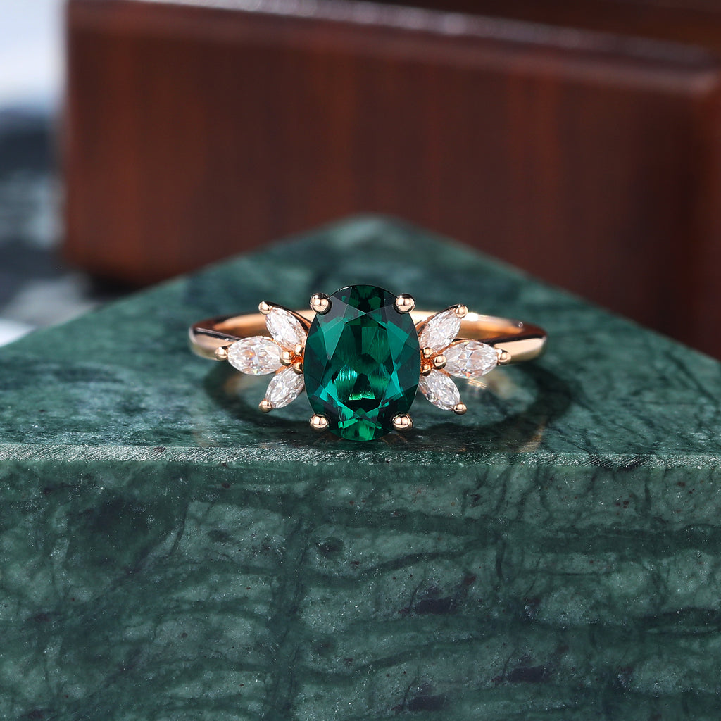 Oval cut Lab Emerald rose gold engagement Ring.