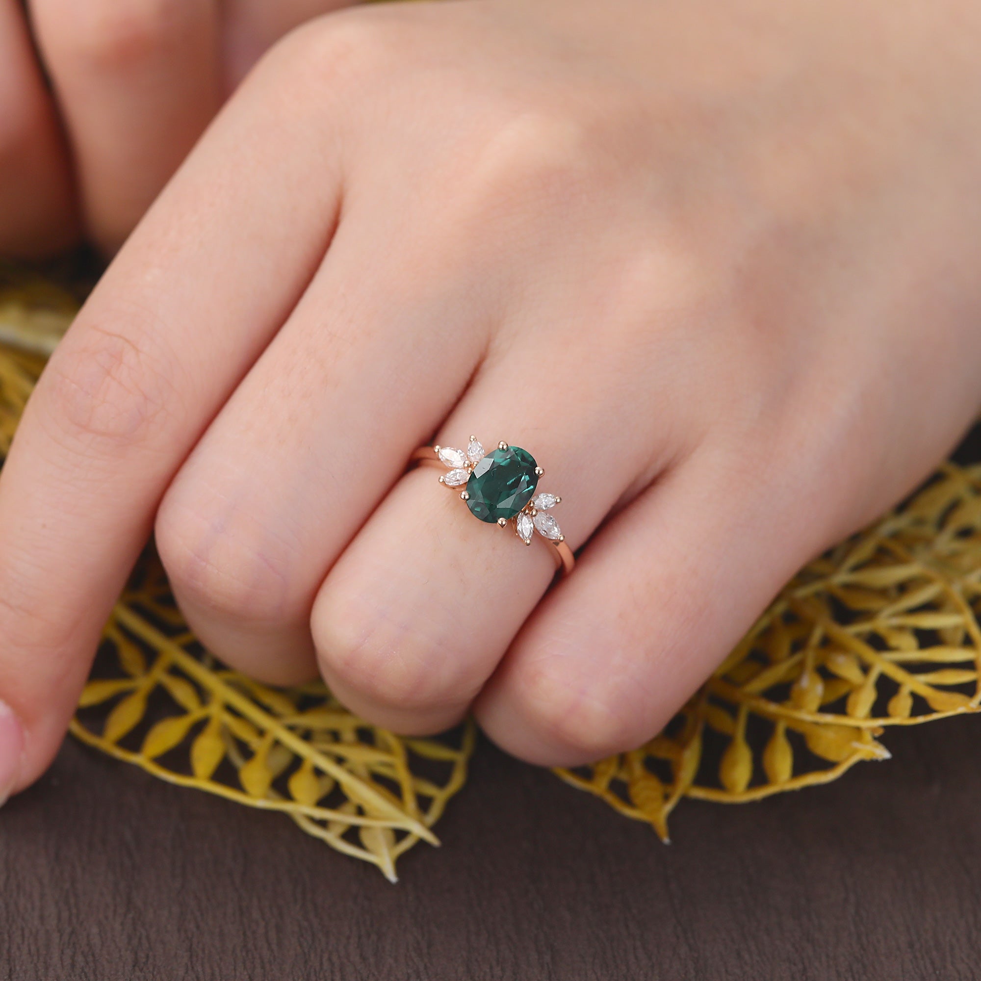 Oval cut Lab Emerald rose gold engagement Ring.