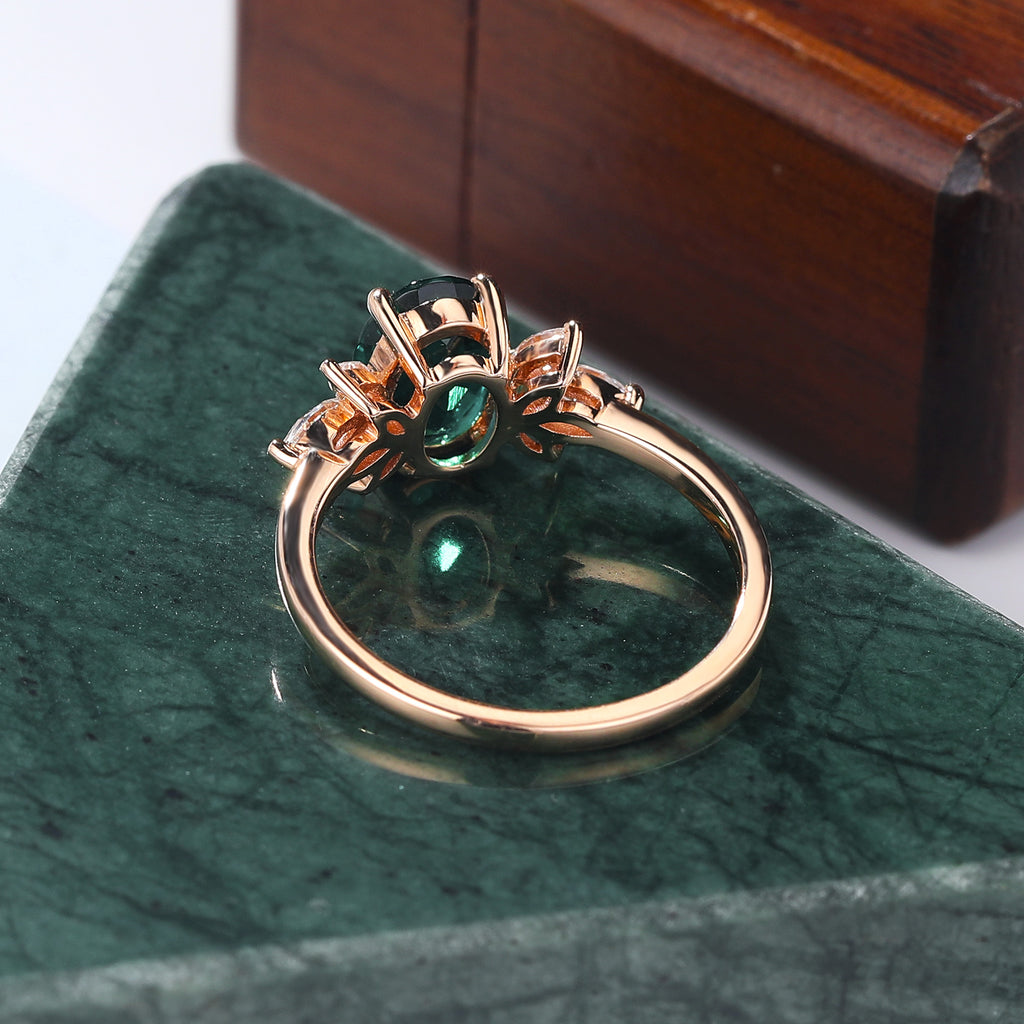 Oval cut Lab Emerald rose gold engagement Ring.