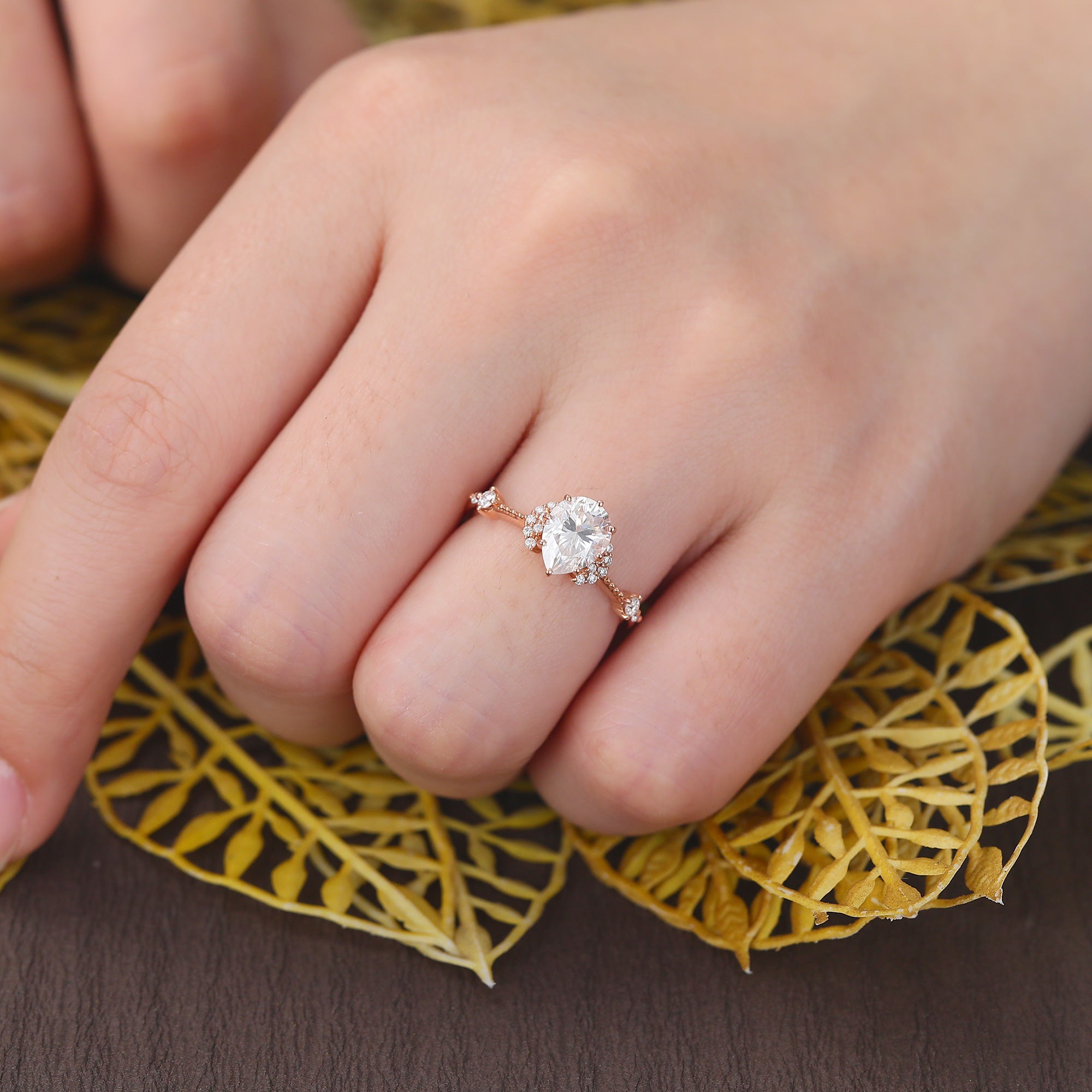Pear shape moissanite rose gold engagement Ring.