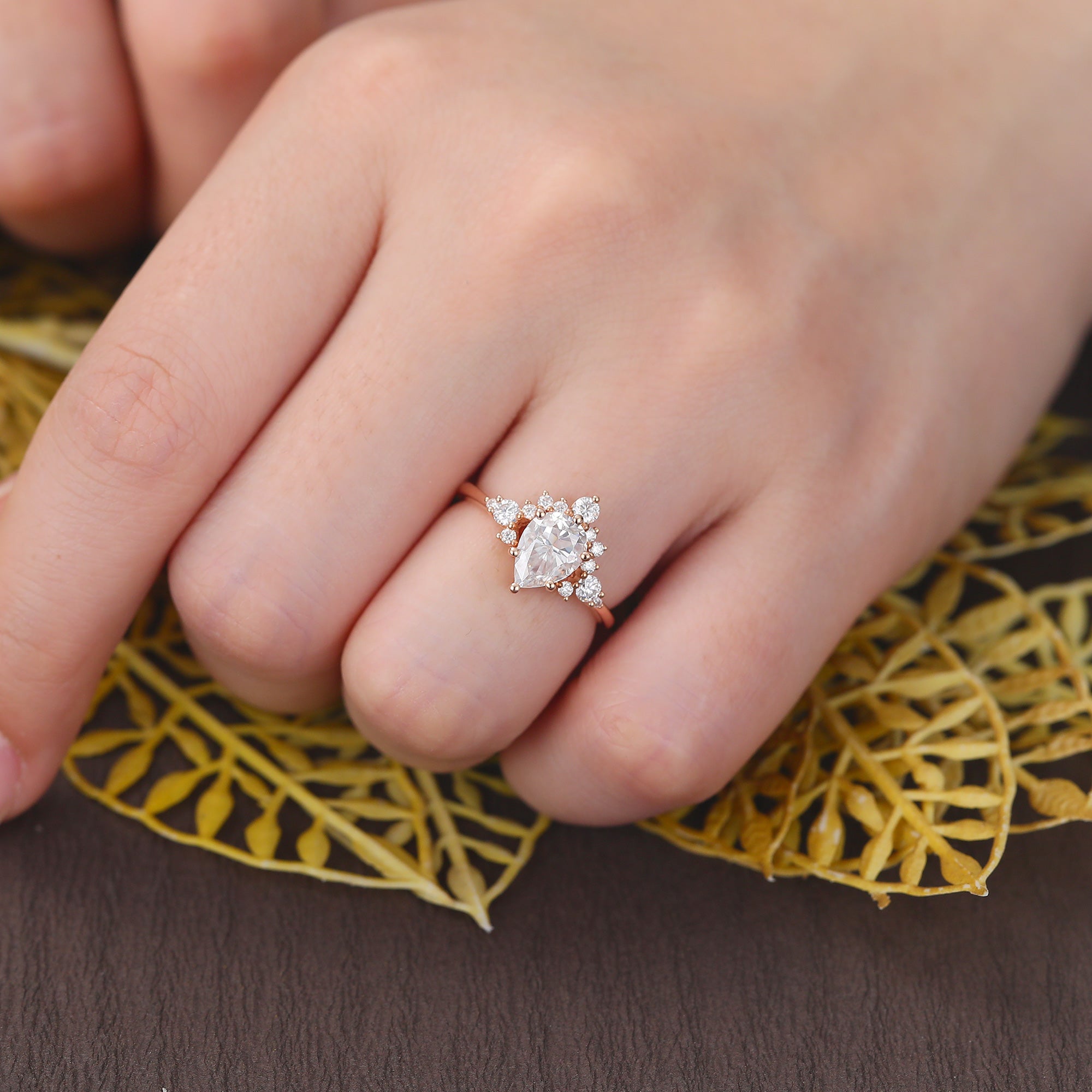 Pear shape moissanite rose gold engagement Ring.