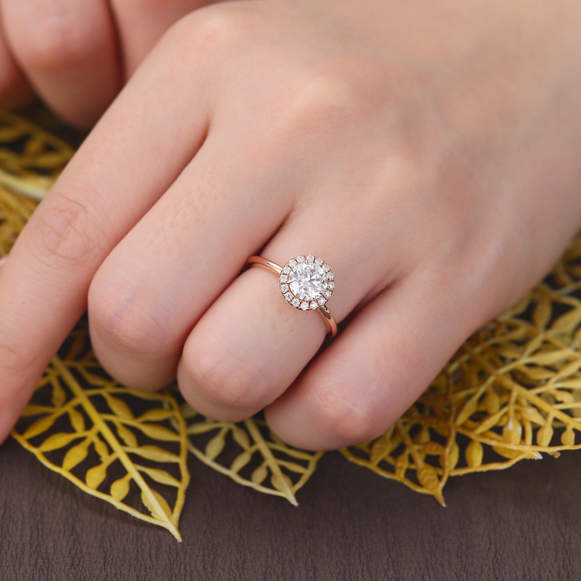 Round cut Moissanite rose gold engagement Ring.